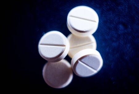 medical pills on a black background. macroplane. drugsの写真素材
