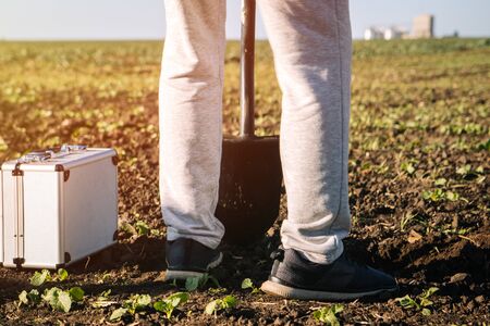 agronomist checks the soil on the fieldの写真素材