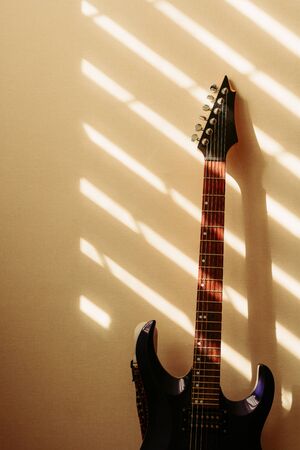 electric guitar against the wall. vintage photoの写真素材