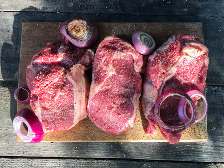 marbled beef steaks. salt and spices. barbecue. wooden background. close-upの写真素材