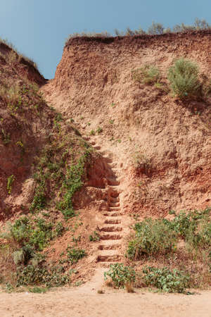 CLAY staircase in the rock. sea coast. sunnyの写真素材