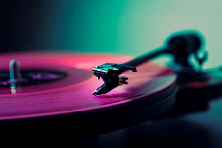 Vinyl DJ turntable in club lighting. close-up. pink tint. retro styleの写真素材
