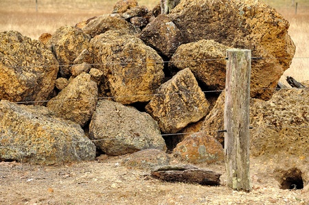 rock pile behind fenceの写真素材
