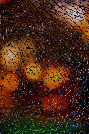 broken pane of glass - autumn shadesの写真素材