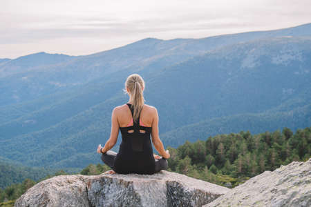 meditation yoga postures in nature inner peaceの写真素材
