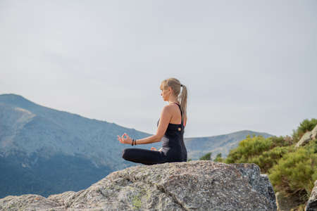 meditation yoga postures in nature inner peaceの写真素材