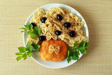 Ukrainian chicken chop of kiev and pasta with olives