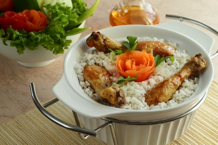 Cooked rice together with a roasted chickenの写真素材