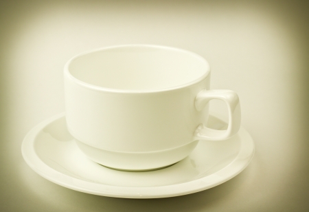 fine retro style image of white cup for coffee or teaの写真素材