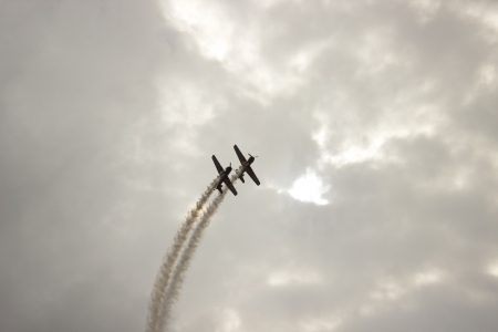 new air show image with small airplanes in extreme exhibitionの写真素材