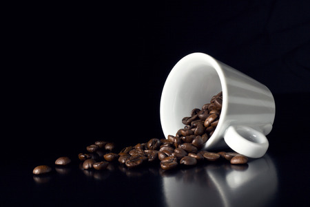 vintage coffee cup with natural beansの写真素材