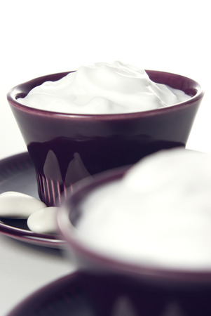 classic yogurt and white candies on morning tableの写真素材