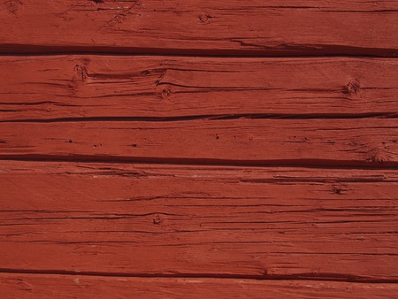 Scandinavian wooden beamed wall painted with traditional falu red paint.の写真素材