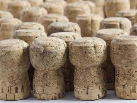 A selection of used champagne corks, sharp foreground and blurred background.の写真素材