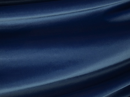 Waves of flowing blue velvet fabric.の写真素材