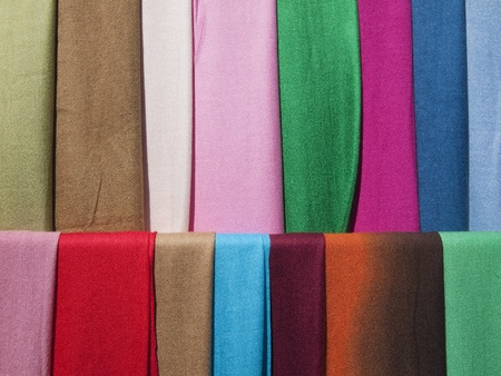 Scarves of many colors on display.の写真素材