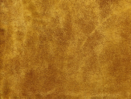 A tanned suede leather background.の写真素材
