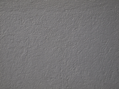 Textured warm grey painted interior cement wall.の写真素材