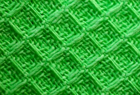 macro pattern of green textile fabric