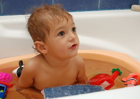little boy taking a bath