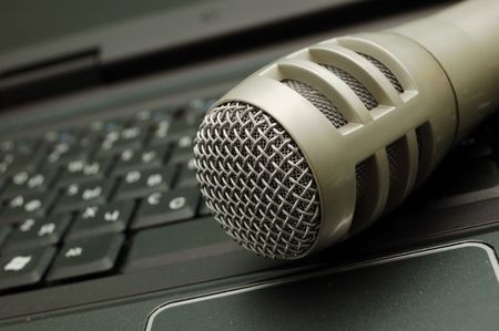 digital sound - dynamic microphone over keyboardの写真素材