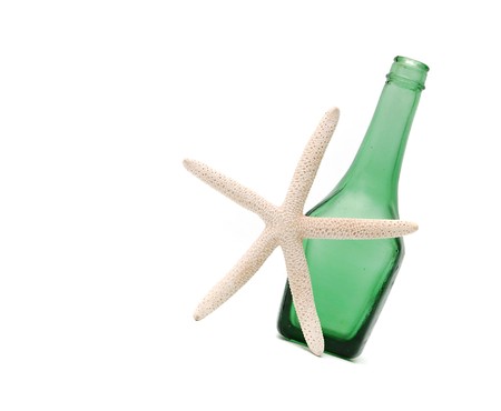 spa concept - green bottle for cosmetics and seastarの写真素材