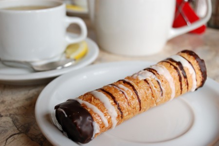 tube fancy cake on white saucer