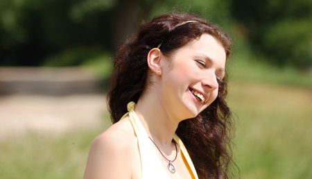 pretty brown-haired typical russian girl at windの写真素材
