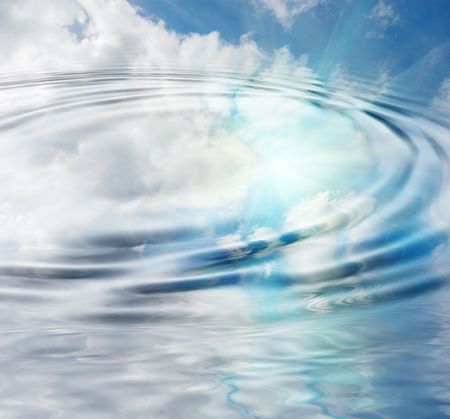 blue sky and sun reflection in pondの写真素材