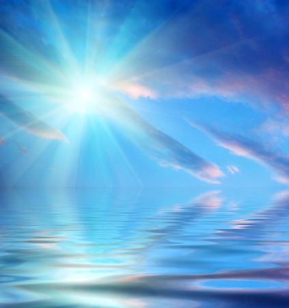 sun, sky, clouds and water with ripplesの写真素材