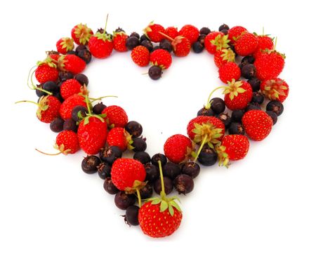 Duality of feelings - heart symbol made of fresh strawberries and bog bilberriesの写真素材