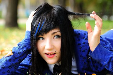 emo-girl in leaves の写真素材