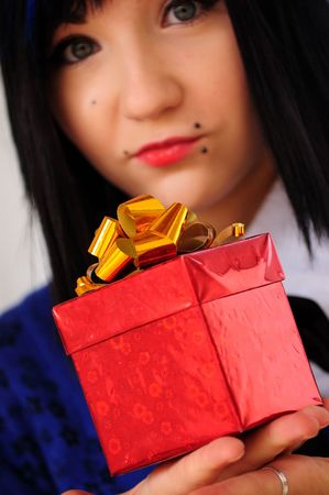funny young pretty long haired blue-eyed  brunette with giftbox