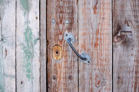 keyhole on the old fashioned wooden doorの写真素材
