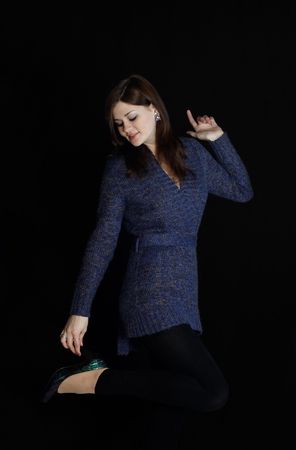cute young pretty girl in stylish knitted blue dressの写真素材