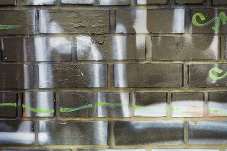 bg of brick wall with graffitiのeditorial素材