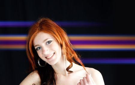 party concept - face of  young pretty girl on black and laser lightの写真素材