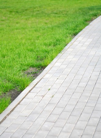 paved lane of the garden and green grassの写真素材