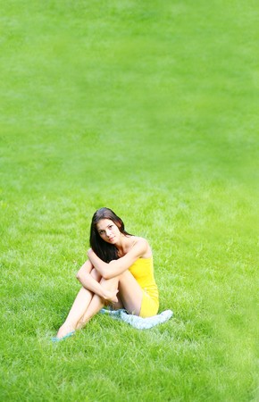 sexy brunette on grassの写真素材