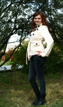 Portrait of a redheaded girl near a tree (autumn colors).の写真素材