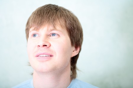 relaxed white  man against of the rooms wallの写真素材