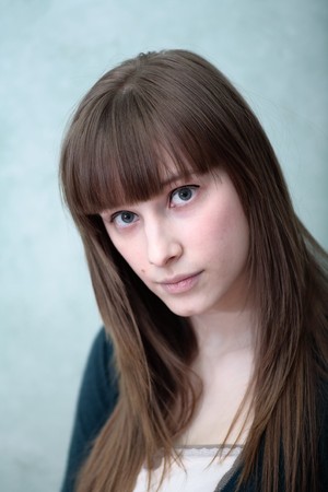 Portrait of attractive girl in a roomの写真素材