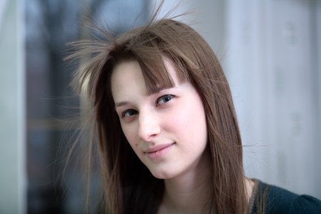 Portrait of attractive girl in a roomの写真素材