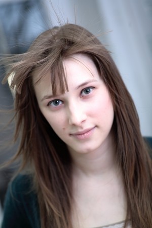 Portrait of attractive girl in a roomの写真素材