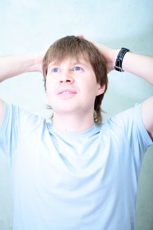 relaxed white  man against of the rooms wallの写真素材