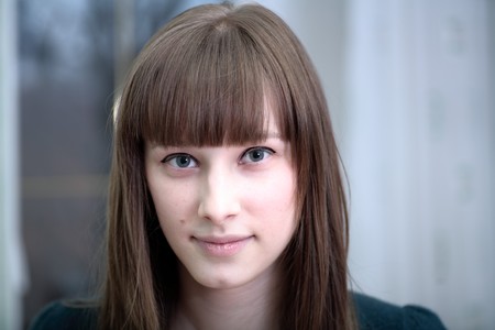 Portrait of attractive girl in a roomの写真素材