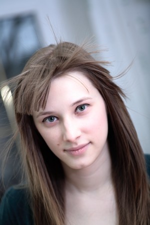 Portrait of attractive girl in a roomの写真素材