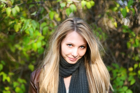 Young cute girl with long dark hairs. Fall. Autumn. Outdoor session.の写真素材