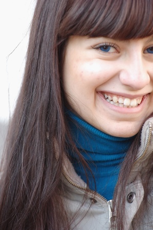 Pretty happy smiling woman headshot closeupの写真素材