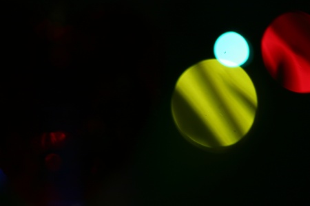 illustration of blurred neon disco light dots pattern on dark background